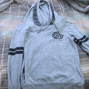 A grey sweat jacket with word love on it